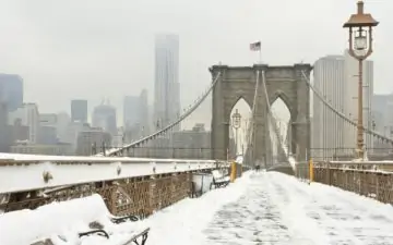 Brooklyn Bridge covered in snow during winter