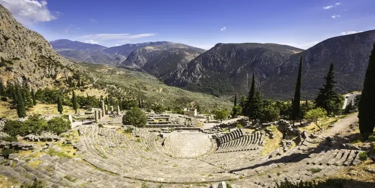 Views of the Apollon temple surrounded by pine forests in Delphi