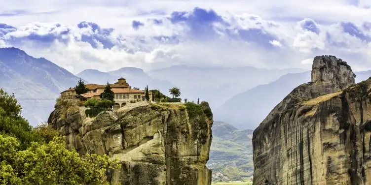A Greek monastery sits on top of a rock, at Meteora, a village located at Kalampaka, Greece.