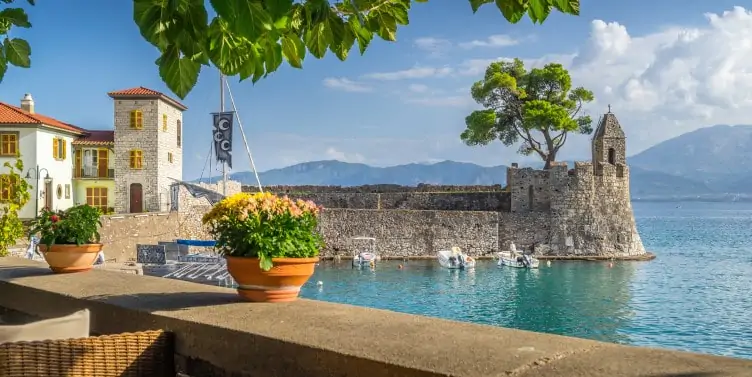 Views of the small harbour in the town of Nafpaktos a former municipality in Aetolia-Acarnania, Greece.