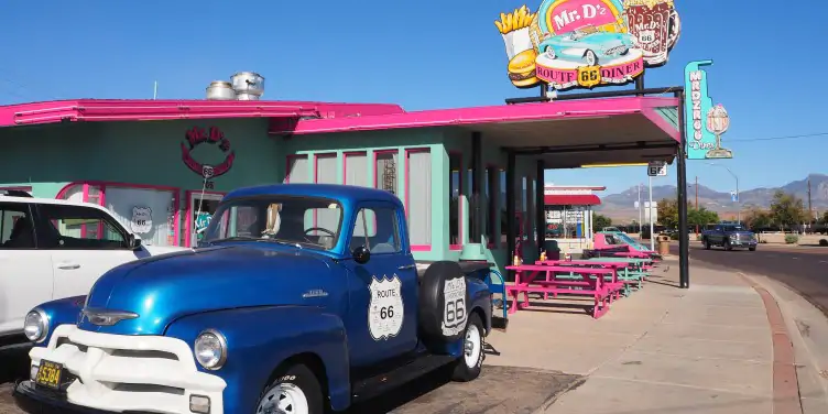 American truck parked outside a Mr D’z bright pink vintage along Route 66 in Arizona