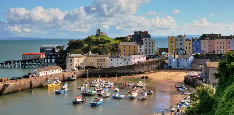 Tenby Harbour with colourful houses and boats