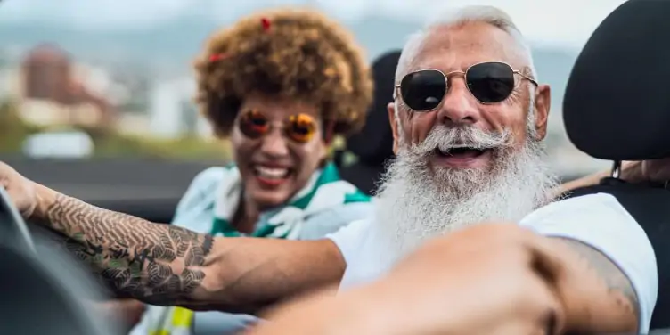 Happy senior couple in convertible car