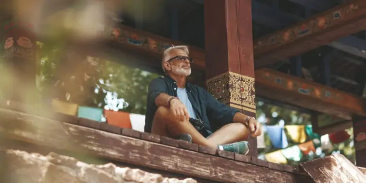 Senior man with beard rest in buddhist monastery