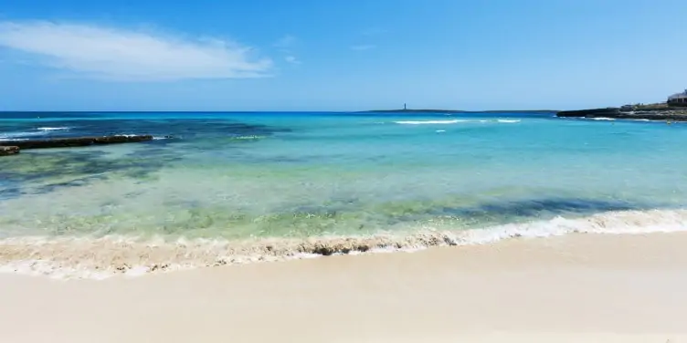 A sandy beach and blue sea in Menorca