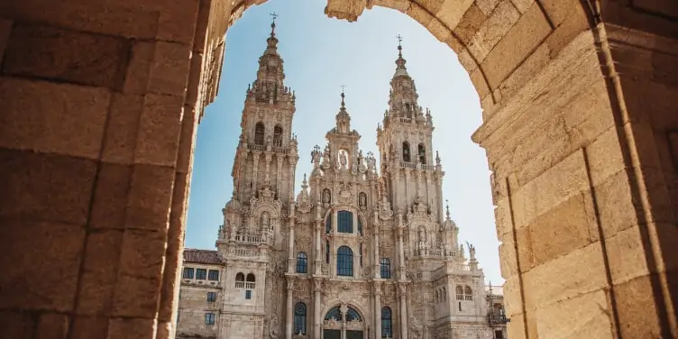 View of the Gothic quarter through archway of Spanish City Santiago de Compostela