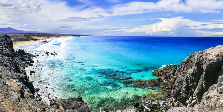 Bright blue sea and rocks.