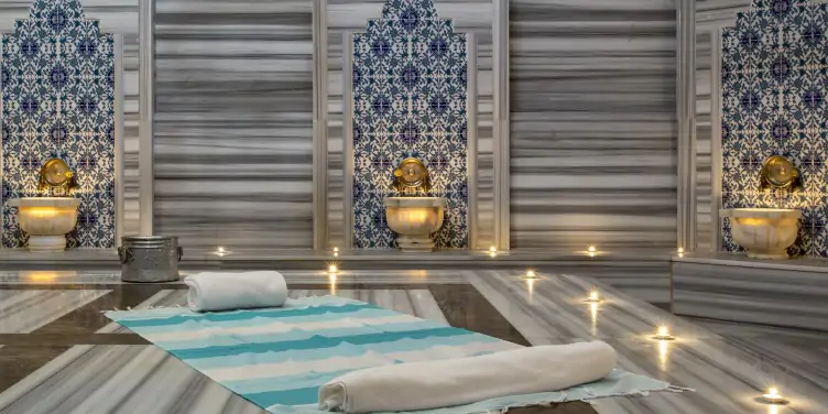 Turkish style bath Hammam with marble floors and gold taps