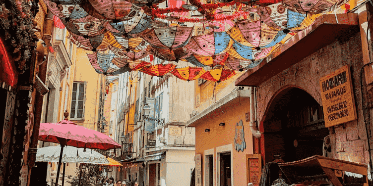 Narrow streets in Old Nice with a canopy of umbrellas