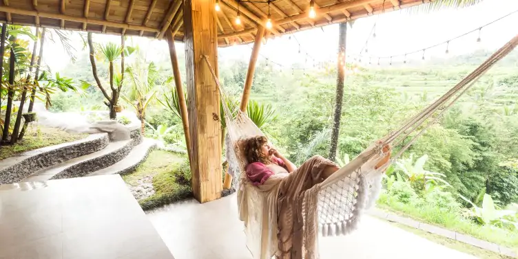 Woman in hammock, enjoying some well-deserved rest time. 